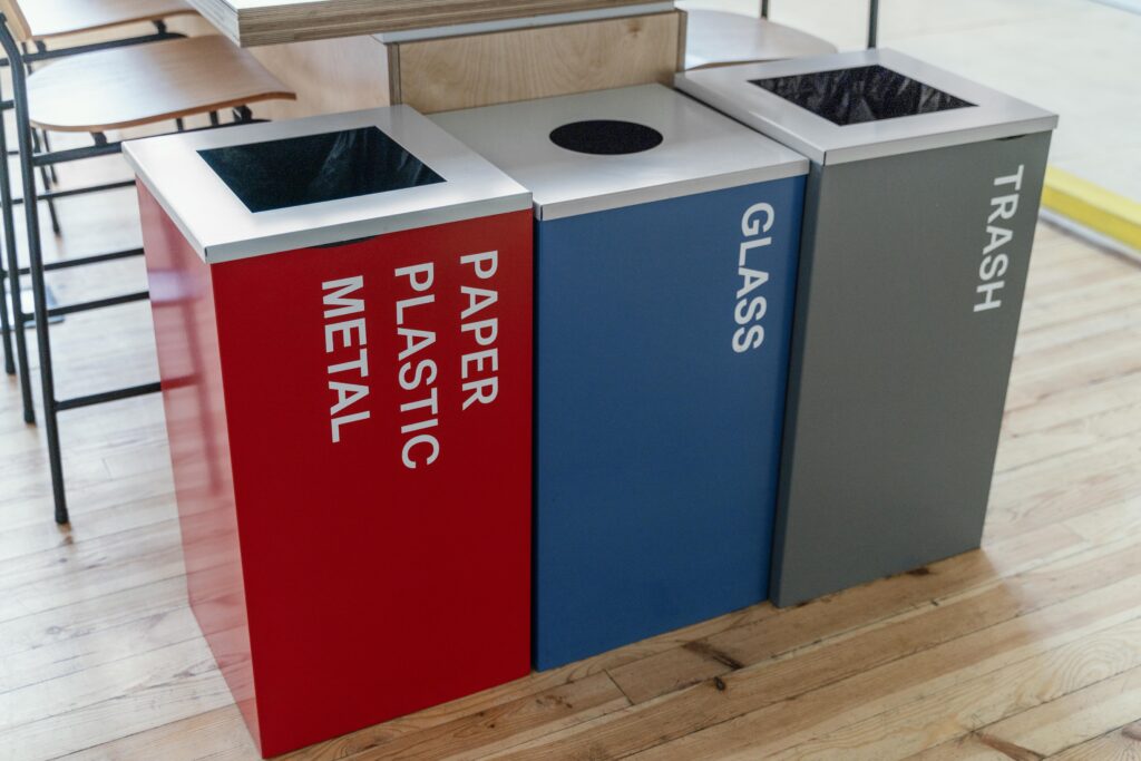 Office bins | Shineo | Office Cleaning Sydney Office recycling bins for waste separation including paper, plastic, metal, glass, and trash in a modern workplace setting.